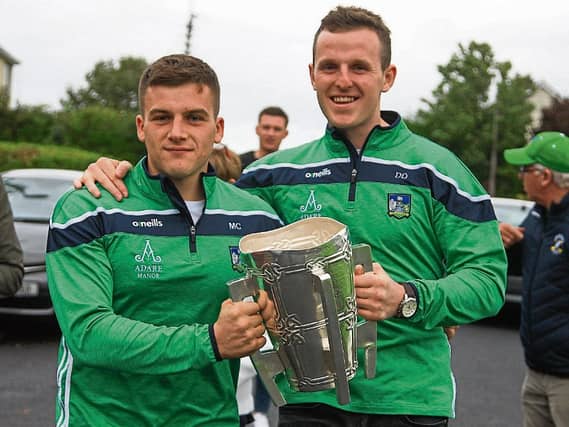 Back on home turf: Michael Casey and David Dempsey arrive at Na Piarsaigh with the Liam MacCarthy cup PICTURE: DERMOT LYNCH
