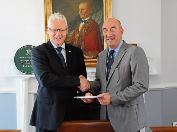Brian Harrington, the chairperson of the Irish Hotels Federation’s, Shannon Branch presents a cheque to David O'Brien, Limerick Civic Trust Picture: Paul Mullins