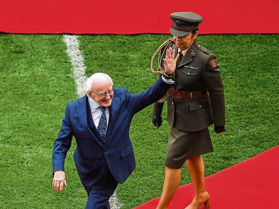 President Michael D Higgins waves to the crowd at the start of the Limerick and Cork semi-final in July