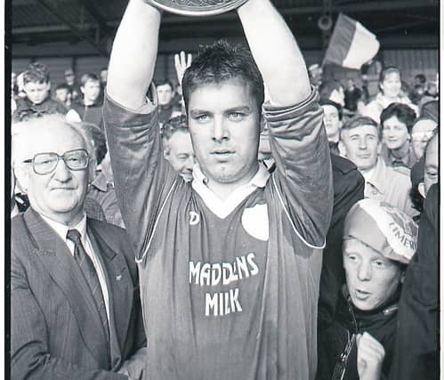John Mullane pictured right of Limerick captain Joe O'Connor as he lifts the 1992 National Hurling League trophy after Tom Boland made the presentation in the Gaelic Grounds