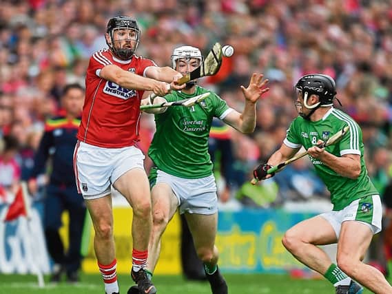 Kyle Hayes and Darragh O'Donovan look to win possession in Pairc Ui Chaoimh