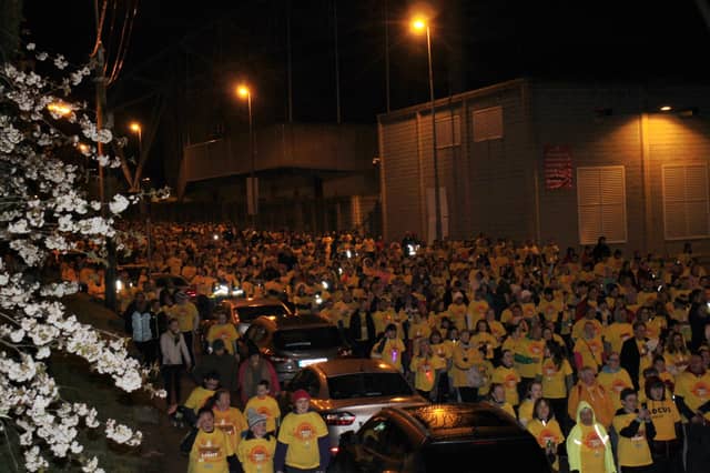 Thousands of walkers stream past Thomond Park on Darkness into Light Picture: Sophie Goodwin/ilovelimerick