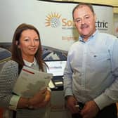 Tom Foley, Solar Electric, speaking to Louise Barry about savings for homes at an information evening on Caherconlish / Caherline’s sustainable energy community plan | PICTURE: Brendan Gleeson