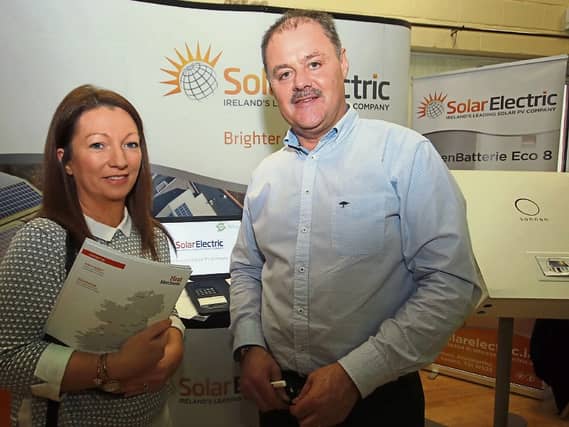 Tom Foley, Solar Electric, speaking to Louise Barry about savings for homes at an information evening on Caherconlish / Caherline’s sustainable energy community plan | PICTURE: Brendan Gleeson