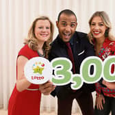 Limerick Lotto presenter Kamal Ibrahim, centre, with fellow presenters Bláthnaid Treacy and Nuala Carey ahead of the milestone 3,000th draw Picture: Mac Innes Photography
