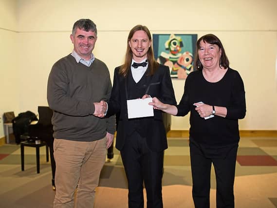 Councillor Richard O’Donoghue and Chairperson Norma Prendiville award the Christopher Lynch Singing Bursary to Kevin Neville at the Rathkeale Community Arts Centre