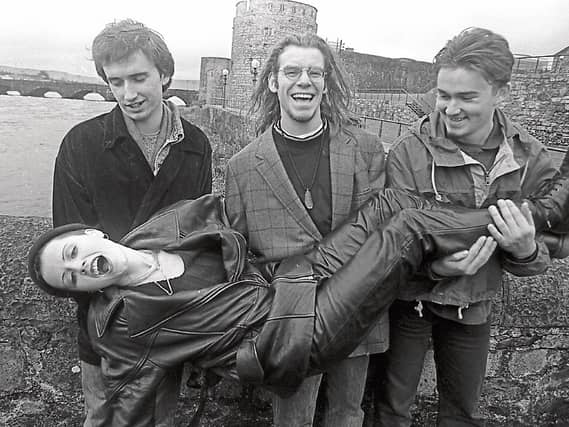 The late Dolores O’Riordan and her Cranberries bandmates having fun at a civic reception in the group’s honour in 1993. Below, with her mum Eileen and meeting Pope John Paul II