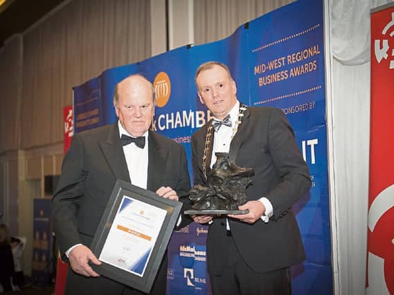 Michael Noonan with Limerick Chamber president Ken Johnson after receiving the president's award recently Picture: Shauna Kennedy