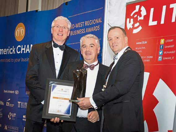 Roadbridge took the best overall company of the year award and the best large company award. CEO Conor Gilligan receives the award from Donal Creaton, HOMS and Ken Johnson, Chamber President
