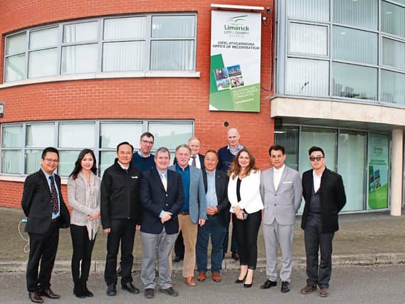 The delegation from Hong Kong, pictured with Senator Kieran O’Donnell and Ray O’Halloran, outside the Limerick Regeneration offices in Moyross | PICTURE: Michael Cowhey
