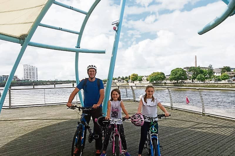 James Powell, Newport, and daughters Emily and Lucy were all smiles on a visit to Limerick city before their bikes were stolen