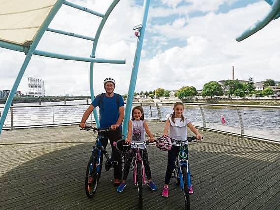 James Powell, Newport, and daughters Emily and Lucy were all smiles on a visit to Limerick city before their bikes were stolen