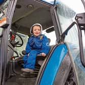 Michael Leonard is pictured on his grandfather's tractor at the launch of the Newcastle West Show