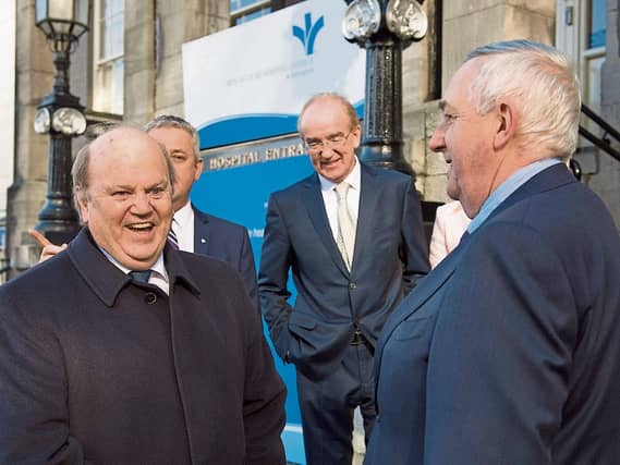 Paul O'Byrne, centre, at the Bon Secours takeover of Barringtons in March Picture: Andrew Downes