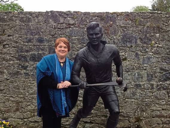 Ann Mulqueen at the Mick Mackey statue in Castleconnell