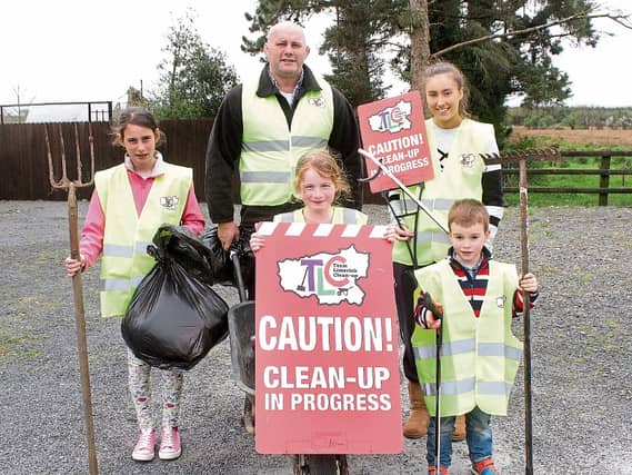 John Hayes with his children Sally, Roisin and Bill, and cousin Yazmin O'Malley ahead of the big clean-up Picture Michael Cowhey