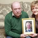 Pictured is Colin and Eithne Bell with a framed photo of their late son, Kevin