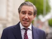 Headshot of Simon Harris speaking outside