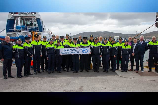 Inspector Gearóid Thompson (pictured at the back behind the sign) at the launch of a refresh of An Garda Síochána’s Coastal Watch in Castletownbere