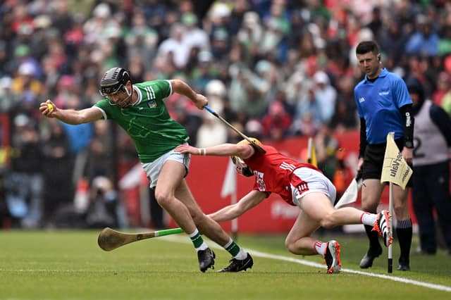 Diarmaid Byrnes of Limerick in action against Shane Barrett of Cork