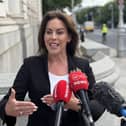 Health Minister Jennifer Carroll MacNeill speaks to the media outside Government Buildings in Dublin