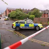 A police cordon at the scene of the stabbing outside apartments in the Kinnaird Avenue area of north Belfast