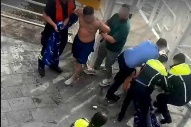 A still from a video, widely shared on social media, of the gardai arresting the men rescued from the Shannon