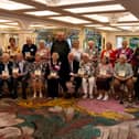 Residents of Embury Close with their book of memories and stories