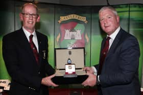 Denis O'Leary, Captain of Castletroy Golf Club presenting the captain's prize to John O'Halloran at the captain's dinner