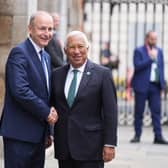 Micheal Martin and Antonio Costa smiling and shaking hands