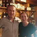 PJ Quigley and Nuala Murray pictured behind the bar at The Black Swan, the city centre pub they've run for the last 26 years