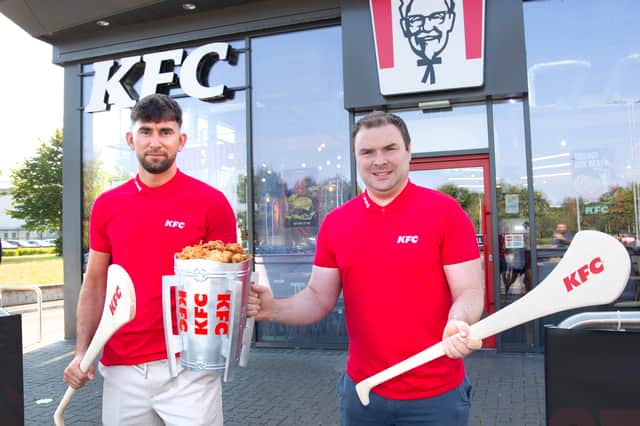 Former Galway hurler Jason Flynn and former Limerick hurler Richie McCarthy launch KFC Ireland's limited-edition McCarthy-inspired buckets ahead of the All-Ireland Senior Hurling Championship final