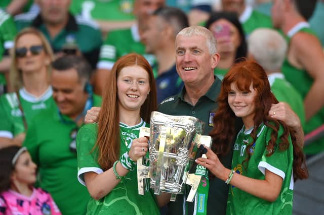 Limerick manager John Kiely with his daughters Ruth and Aoife, as well as the Liam MacCarthy Cup after the win over Galway