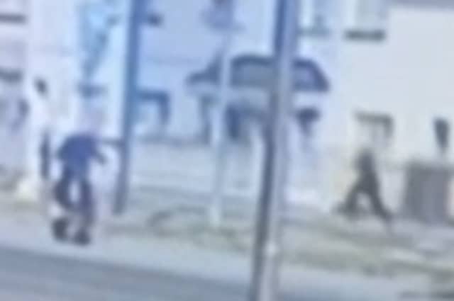 A still from a video, which has been widely shared on social media, shows the purported gunman running back to the getaway driver