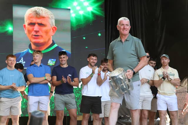 Limerick senior hurling manager John Kiely applauded by his players as he takes to the stage at the homecoming, Liam MacCarthy in hand | PICTURE: Adrian Butler