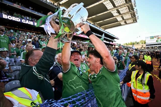 Sean Finn of Limerick celebrates with supporters and the Liam MacCarthy Cup after the All-Ireland final win