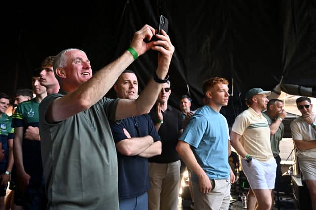 Limerick manager John Kiely takes a video on his smartphone of the supporters at the homecoming celebrations of the All-Ireland Senior Hurling Champions at Pery Square