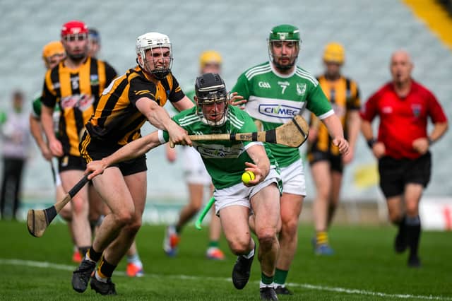 Tommy Quaid of Effin is tackled by Robert Sampson of Garryspillane during last year's Premier Intermediate Hurling Championship final at the TUS Gaelic Grounds