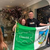 Limerick hurler Darragh O'Donovan reunites with famous flag and its owner, Kathleen Delaney. PICTURE: FACEBOOK