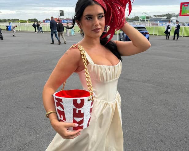 Limerick influencer Chloe Koyce  pictured showcasing a bespoke KFC-inspired fascinator and matching bucket bag, designed by Irish designer Maya Grisham at the Galway Races
PICTURE: Galway Races