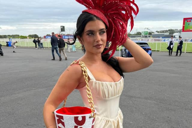 Limerick influencer Chloe Koyce pictured showcasing a bespoke KFC-inspired fascinator and matching bucket bag, designed by Irish designer Maya Grisham at the Galway Races
PICTURE: Galway Races