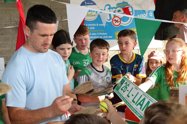 Darragh O'Donovan was in demand to get hurleys, sliotars and even 26-L-LIAM signs signed! | PICTURE: Adrian Butler