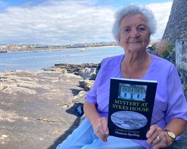 Limerick Leader columnist and author, Maureen Sparling with her latest book, Mystery at Sykes House, overlooking Kilkee Bay