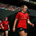 Munster captain Aoife Corey walks onto the pitch before the Vodafone Women's Interprovincial Championship Round 3 match between Connacht and Munster at Dexcom Stadium in Galway