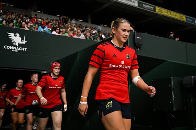 Munster captain Aoife Corey walks onto the pitch before the Vodafone Women's Interprovincial Championship Round 3 match between Connacht and Munster at Dexcom Stadium in Galway