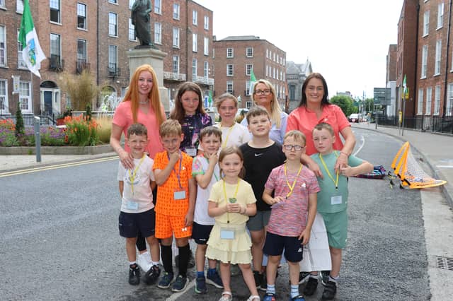 Aoibheann Fitzpatrick, Melanie Quinlivan and Rachel Dargan of Nursery Times Creche with children from the creche | PICTURE: Adrian Butler