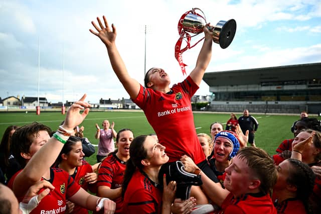 Captain Maeve Óg OLeary celebrates with the trophy and her team-mates after the Vodafone Womens Interprovincial Championship final match between Munster and Leinster