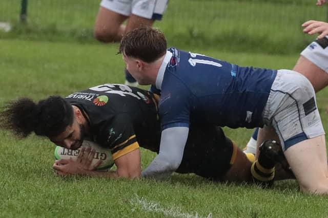 Thomond's Sam Birrane takes Young Munster's Joshua Costello to the ground during their game at Fitzgerald Park