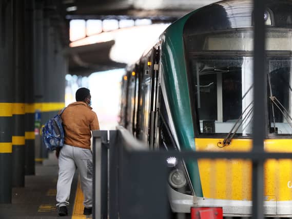A person walking by a train