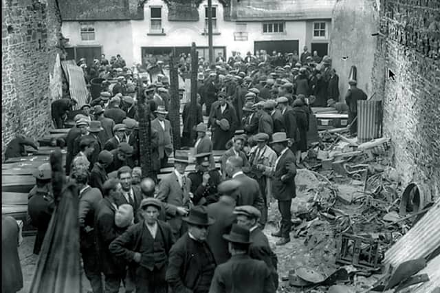 Coffins at the site where 48 men, women and children perished in 1926 after a candle fell on the highly-flammable film reels in a timber barn being used as a temporary cinema